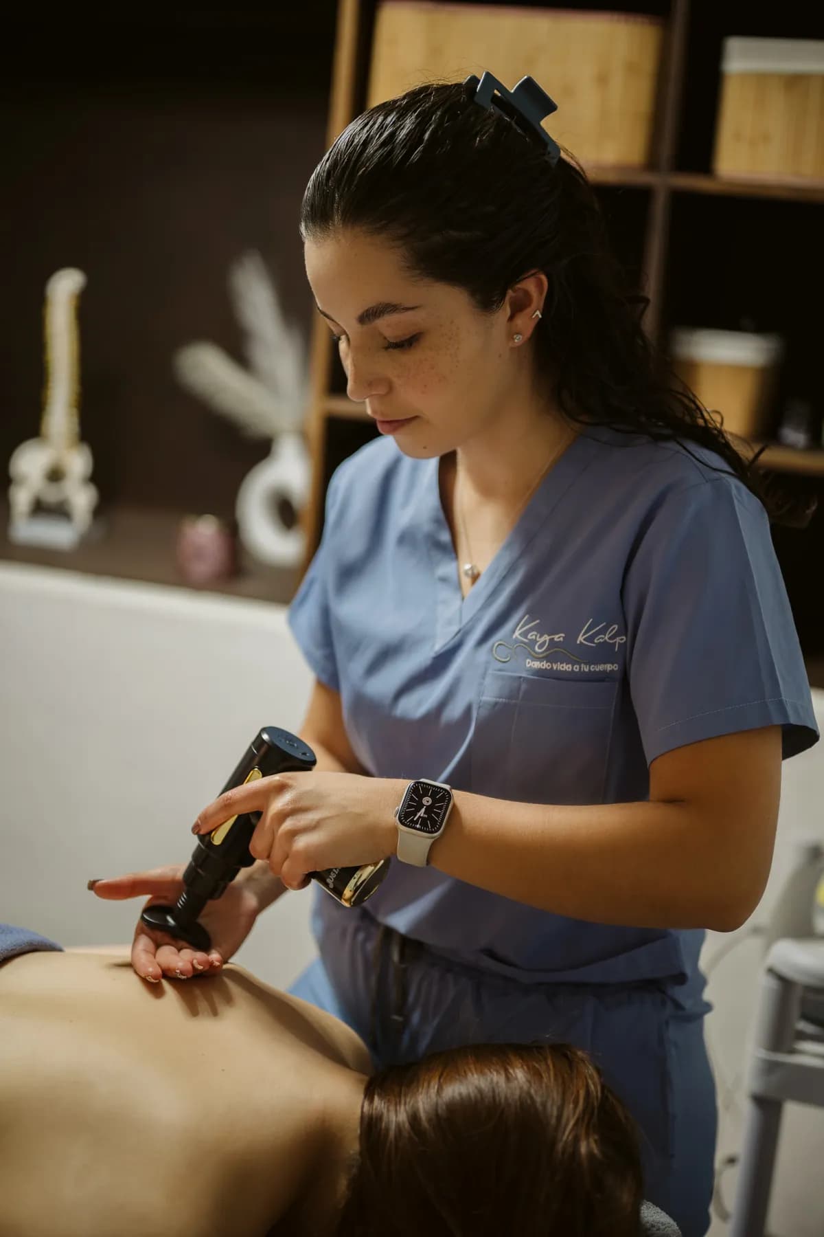 Terapia con pistola de percusión